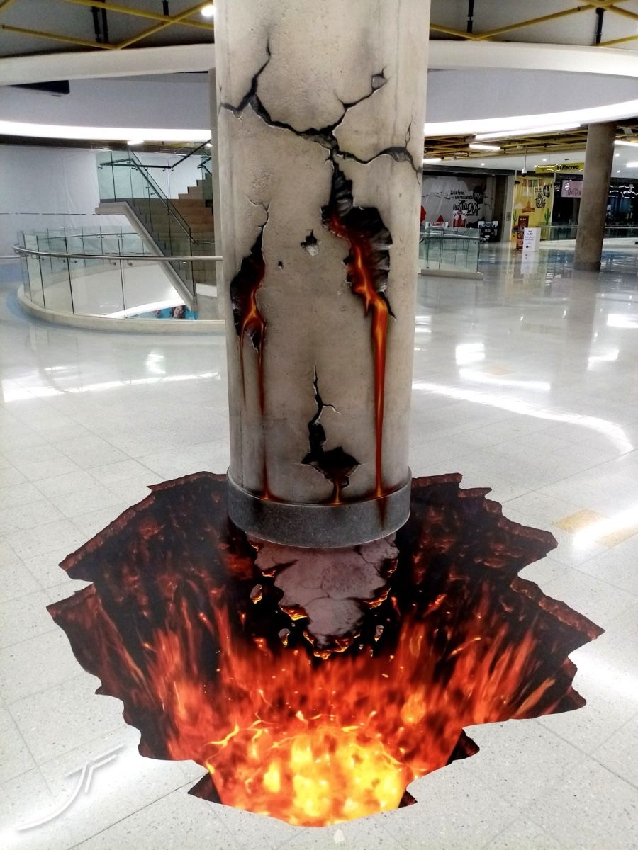 Columna con grietas y lava que se abre en un cráter de lava 3D en el suelo de un centro comercial