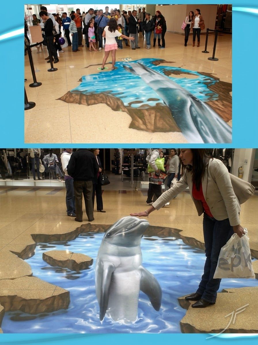 Delfín 3D sobre una piscina de agua pintada en el suelo, con personas interactuando